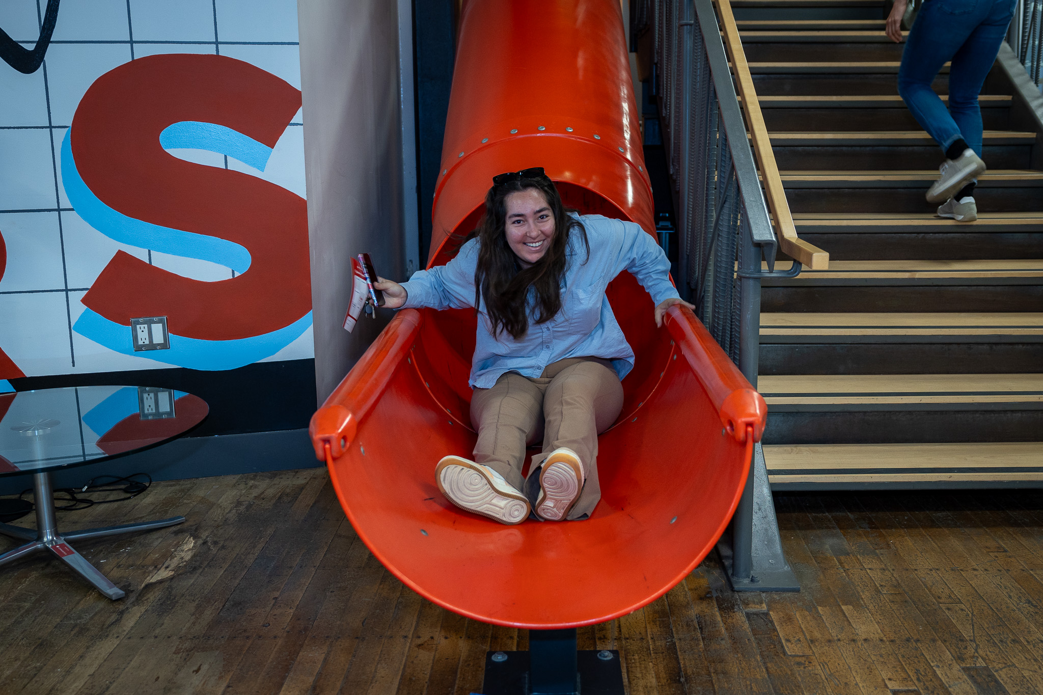 An attendee taking the slide down
