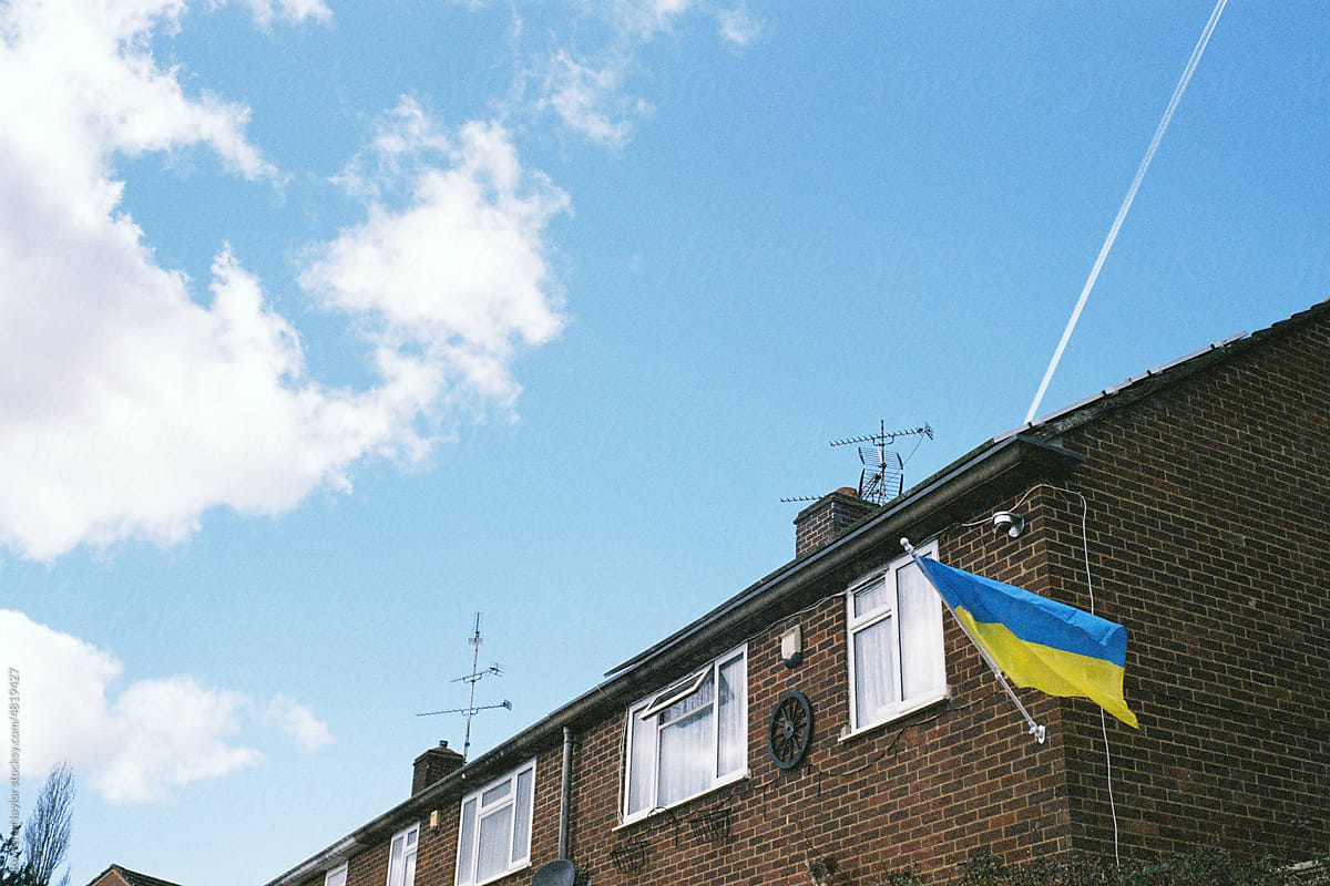 building with Ukraine flag in the window