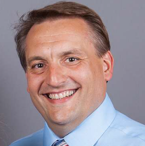 Headshot of John Neufeld, House of Friendship Executive Director