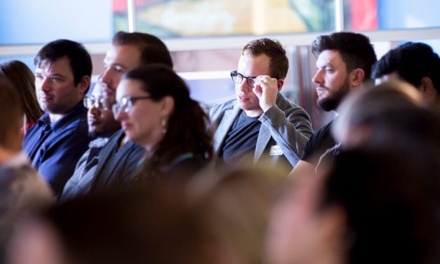 Guests listening to the fireside chat