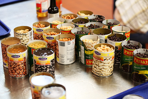 Open cans of various beans