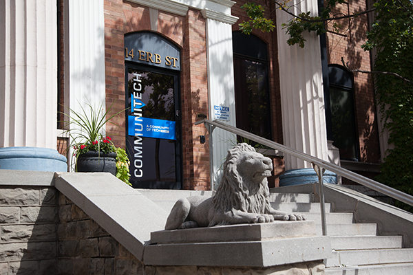 Outside of the Data Hub featuring a lion statue