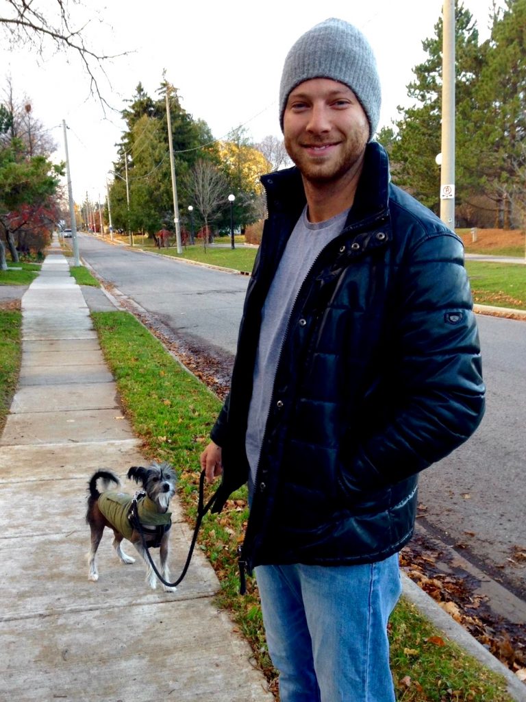 Michael Litt and their dog Pepe outside