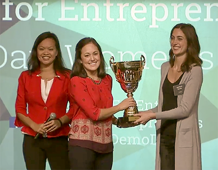Bridgit founders on stage accepting a trophy